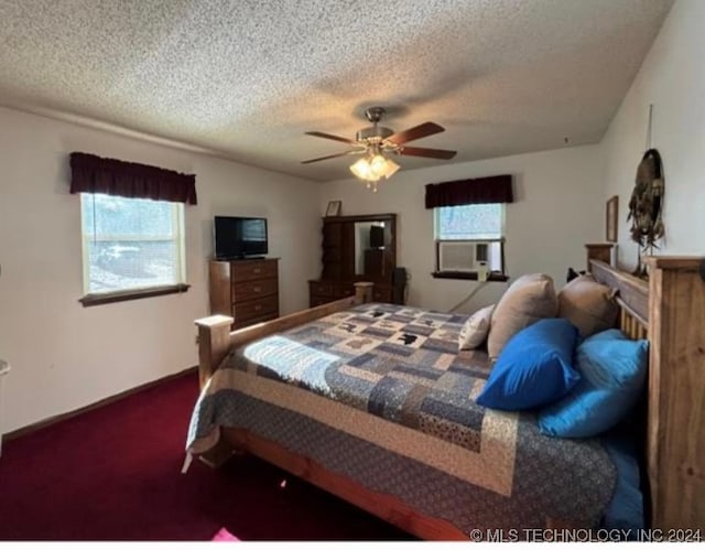 bedroom with ceiling fan, cooling unit, carpet floors, and a textured ceiling