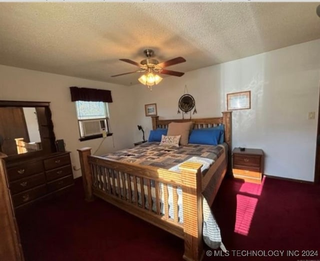 carpeted bedroom featuring a textured ceiling and ceiling fan