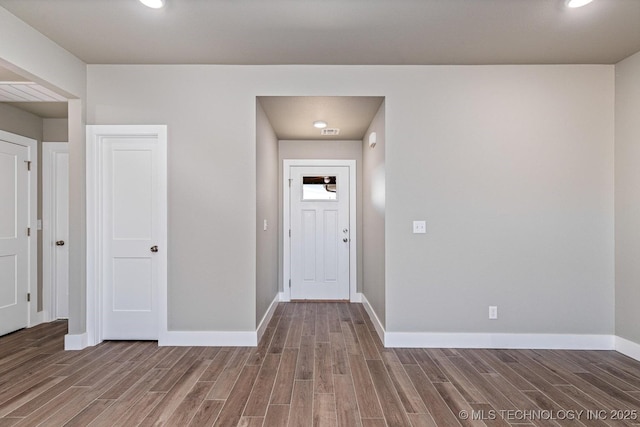 entryway with wood-type flooring