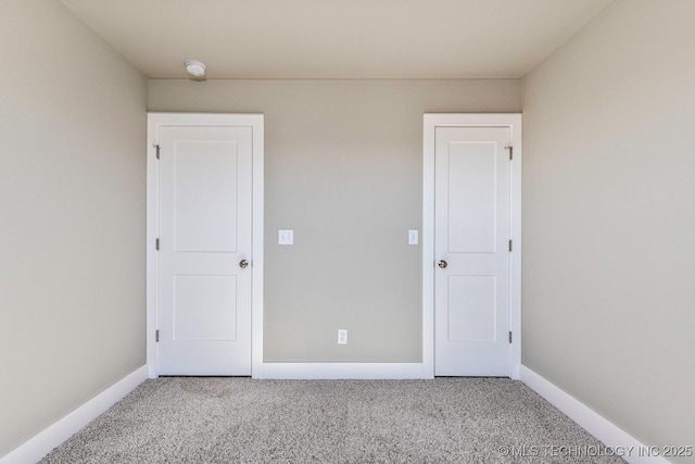 empty room featuring light colored carpet