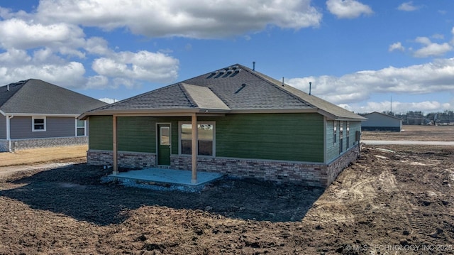 back of property with a patio area