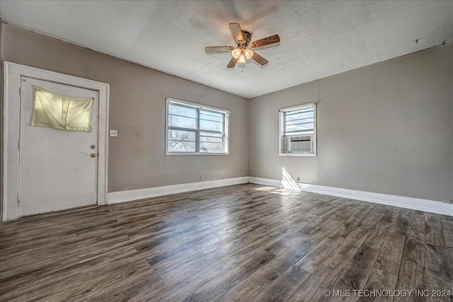 entrance foyer with ceiling fan, a textured ceiling, and dark hardwood / wood-style flooring