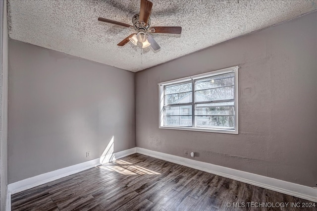 empty room featuring a textured ceiling, ceiling fan, and dark hardwood / wood-style flooring