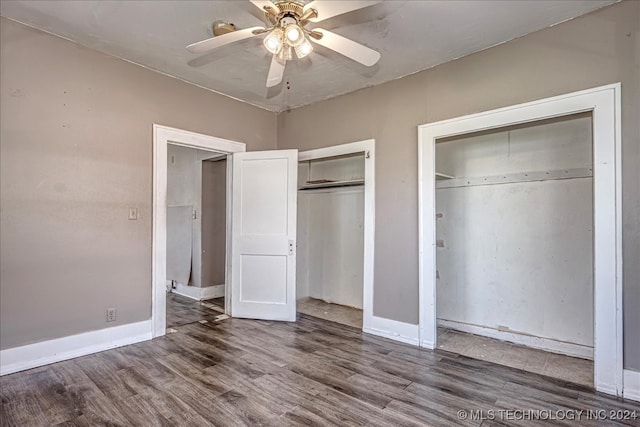 unfurnished bedroom with ceiling fan and hardwood / wood-style floors