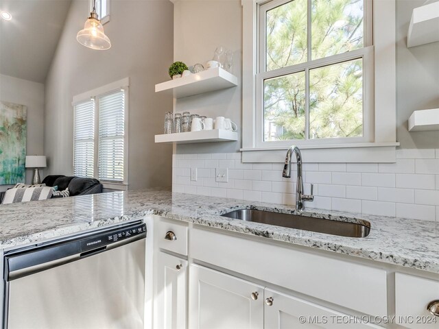 86 Ridgeline, Carlton Landing, OK 74432 - kitchen featuring stainless steel dishwasher, tasteful backsplash, open shelves, a sink, and white cabinetry