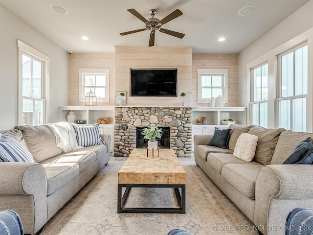 86 Ridgeline, Carlton Landing, OK 74432 - living area with ceiling fan, a stone fireplace, and recessed lighting