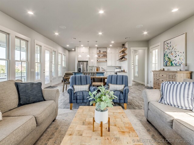 86 Ridgeline, Carlton Landing, OK 74432 - living area featuring baseboards, light wood-style floors, and recessed lighting