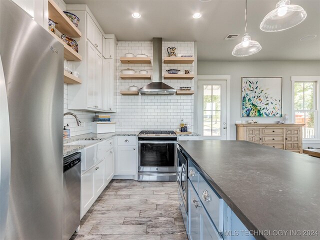 86 Ridgeline, Carlton Landing, OK 74432 - kitchen with open shelves, decorative backsplash, white cabinets, and appliances with stainless steel finishes
