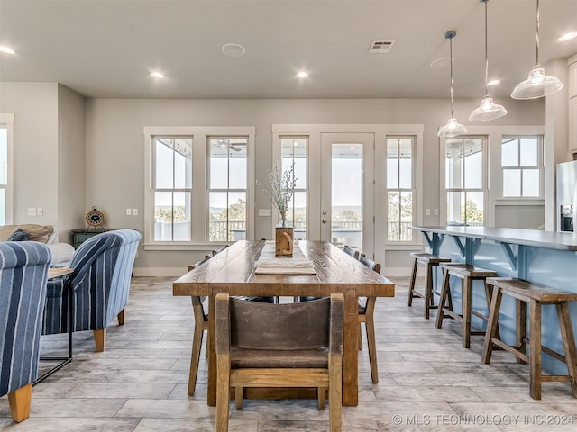 86 Ridgeline, Carlton Landing, OK 74432 - dining room with light wood finished floors, a ceiling fan, baseboards, and visible vents