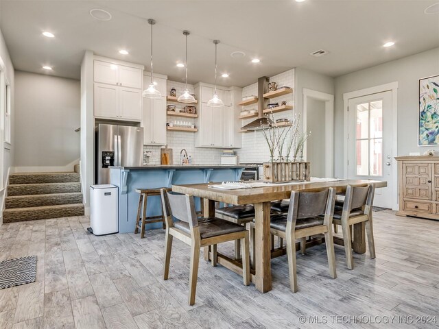 86 Ridgeline, Carlton Landing, OK 74432 - dining space featuring recessed lighting, stairs, visible vents, and light wood-style flooring