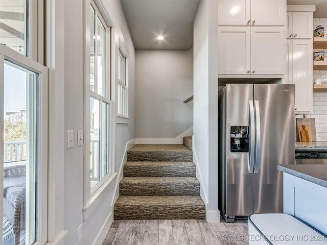 86 Ridgeline, Carlton Landing, OK 74432 - staircase featuring baseboards, a healthy amount of sunlight, wood finished floors, and recessed lighting