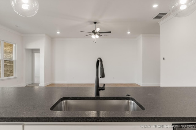 2804 E Northampton St, Broken Arrow, OK 74014 - kitchen with a sink, ceiling fan, crown molding, recessed lighting, and stainless steel dishwasher