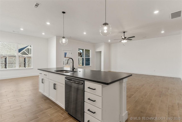 2804 E Northampton St, Broken Arrow, OK 74014 - kitchen with stainless steel dishwasher, a sink, dark countertops, open floor plan, and light wood-style flooring