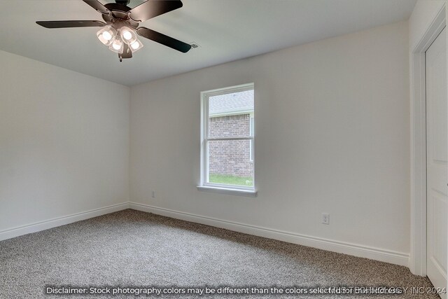 carpeted empty room with ceiling fan