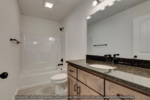 full bathroom featuring shower / bath combination, vanity, and toilet