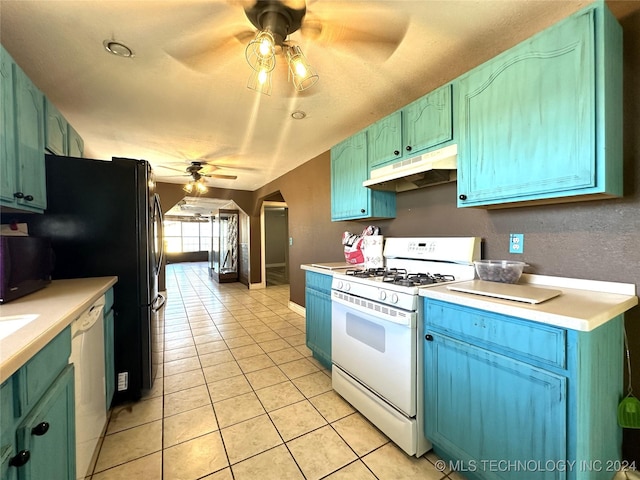 kitchen with white gas range, under cabinet range hood, light tile patterned flooring, dishwashing machine, and a ceiling fan