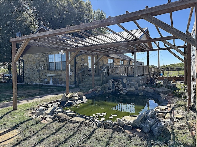 exterior space featuring a garden pond