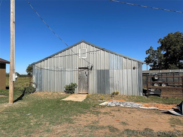 view of pole building featuring fence