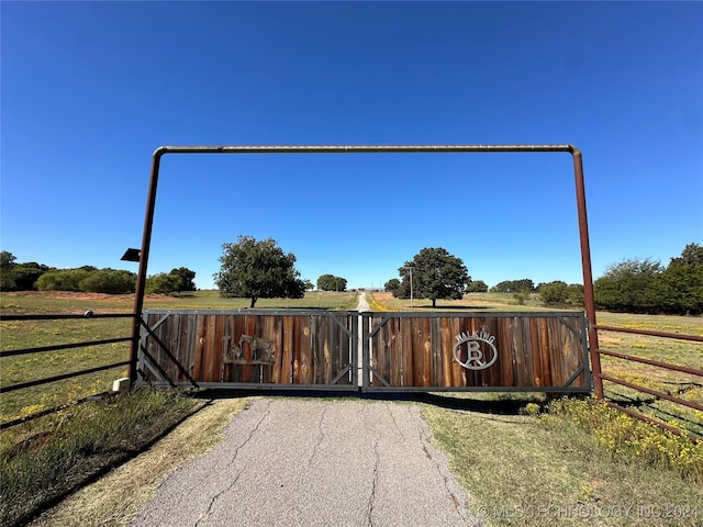view of gate featuring fence