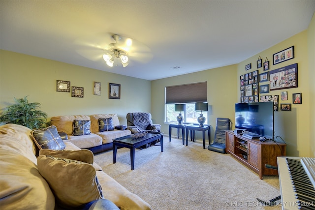 carpeted living room featuring ceiling fan