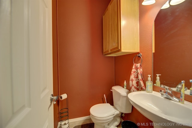 bathroom featuring sink and toilet