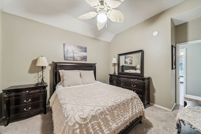 carpeted bedroom featuring ceiling fan, baseboards, and vaulted ceiling