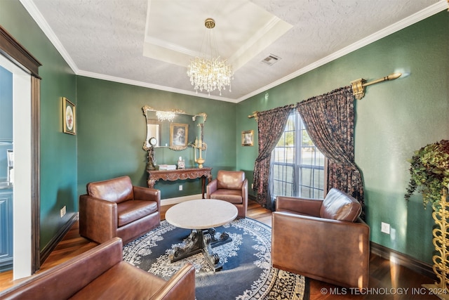 living room with wood finished floors, visible vents, and baseboards