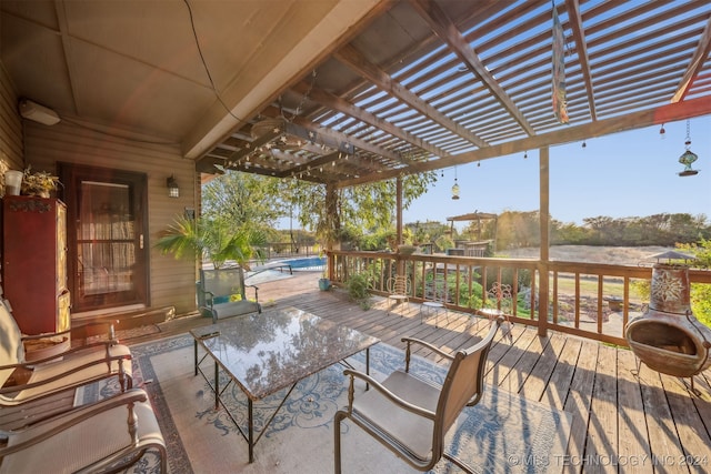 wooden deck with an outdoor pool, a pergola, and outdoor dining area