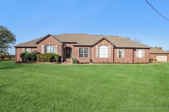 ranch-style home featuring crawl space, brick siding, roof with shingles, and a front yard