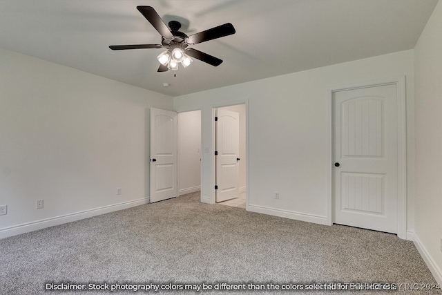 unfurnished bedroom featuring ceiling fan and light colored carpet