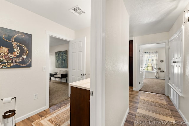 corridor featuring light hardwood / wood-style flooring