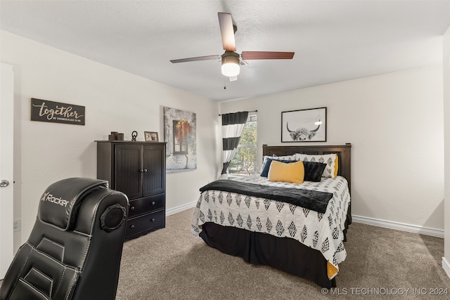 carpeted bedroom with a textured ceiling and ceiling fan