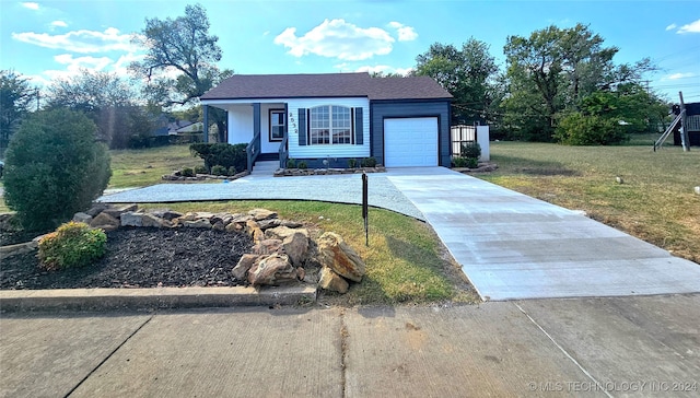 view of front of house with a garage and a front lawn