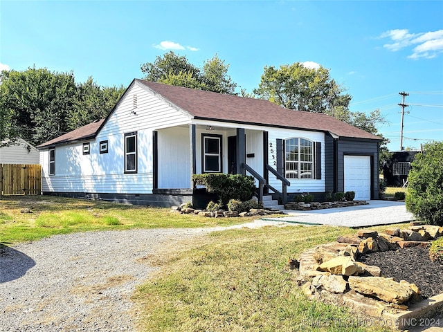 2532 N Martin Luther King Jr Blvd, Tulsa, OK 74106 - ranch-style house with an attached garage, driveway, crawl space, covered porch, and roof with shingles
