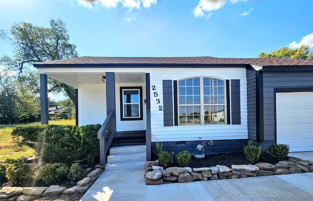 view of front of property with a garage