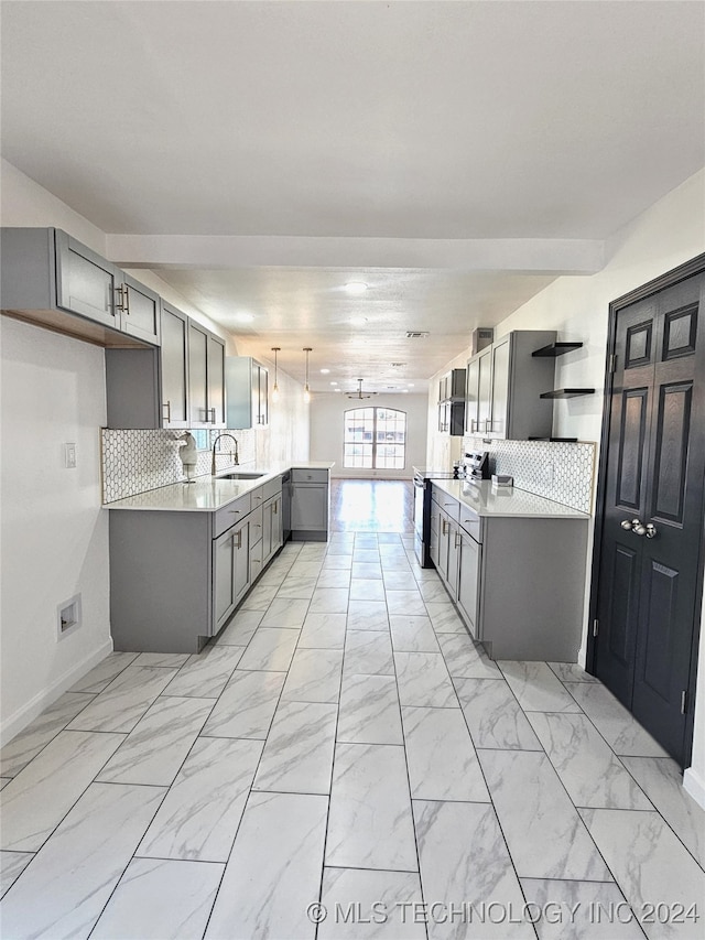 kitchen featuring gray cabinetry, sink, pendant lighting, stainless steel electric range oven, and backsplash