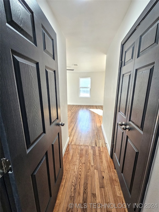 hall with light hardwood / wood-style floors