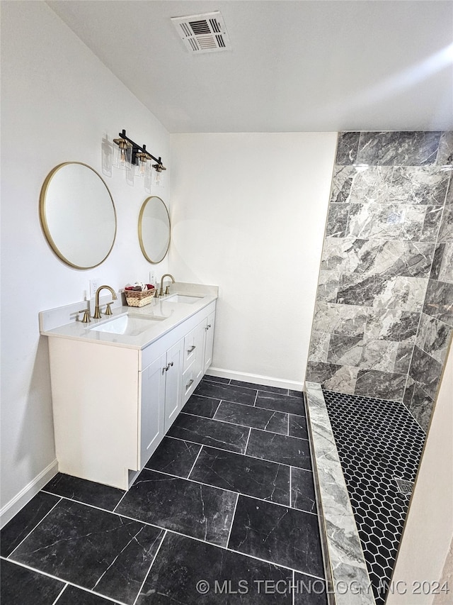 2532 N Martin Luther King Jr Blvd, Tulsa, OK 74106 - full bath with baseboards, double vanity, a tile shower, and marble finish flooring