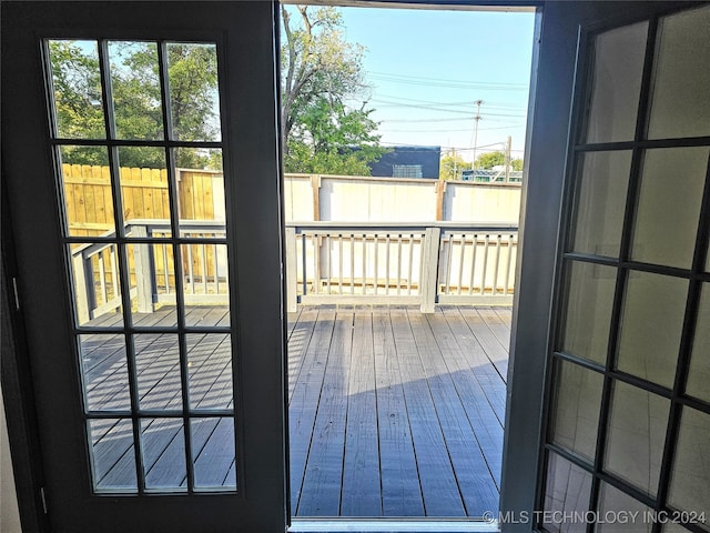 doorway with hardwood / wood-style floors