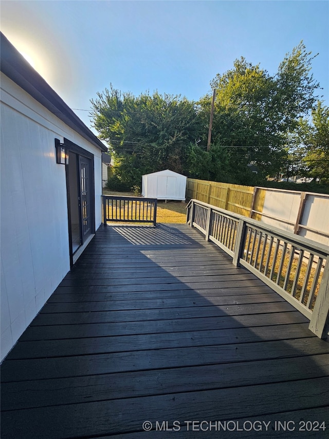 wooden deck with a storage unit