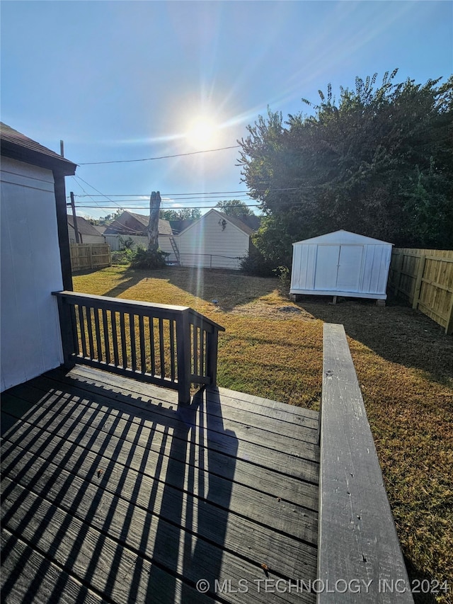 deck featuring a shed