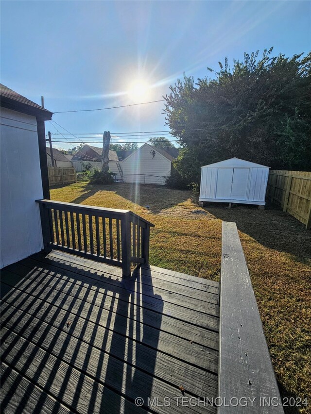 2532 N Martin Luther King Jr Blvd, Tulsa, OK 74106 - wooden deck with a storage shed and an outbuilding