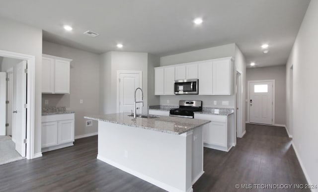 kitchen featuring stainless steel appliances, white cabinets, a kitchen island with sink, and sink