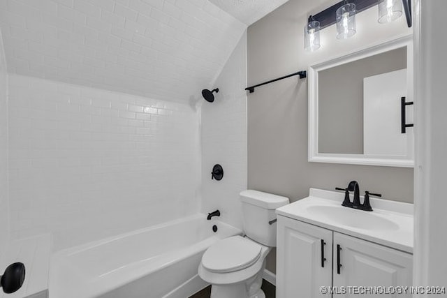 full bathroom featuring lofted ceiling, tiled shower / bath, vanity, and toilet