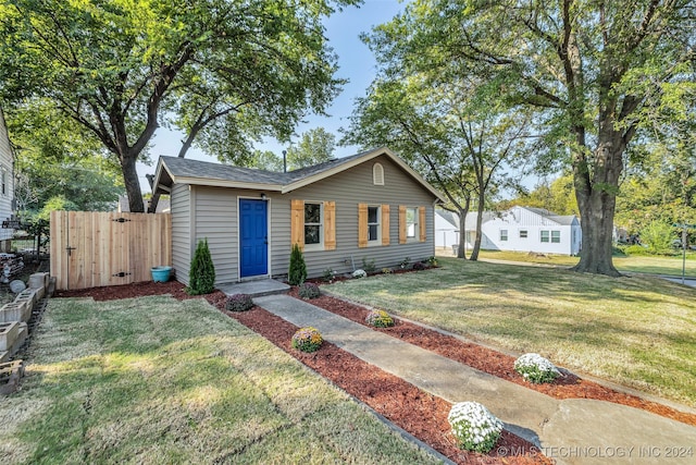 single story home with a front yard