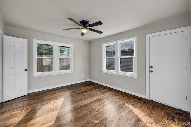 spare room featuring ceiling fan and dark hardwood / wood-style floors