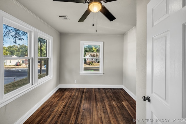 spare room with crown molding, ceiling fan, and dark hardwood / wood-style flooring