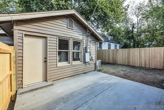 exterior space featuring central AC unit and a patio