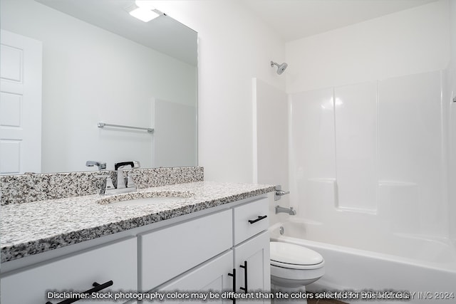 full bathroom featuring vanity, toilet, and  shower combination