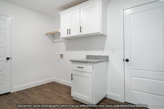 laundry area featuring hookup for a washing machine, cabinets, and dark hardwood / wood-style floors